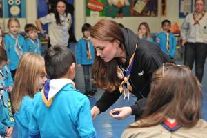 HRHKate gives disability badge to Ava. Photo via Twitter @ScoutsUK